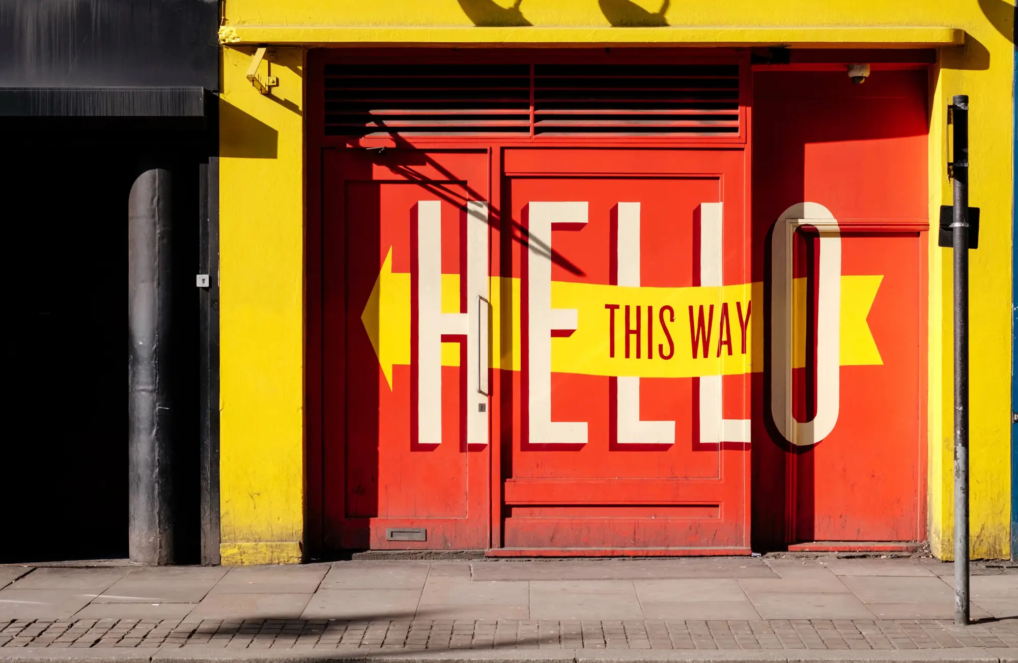 Hello sign painted on business outdoor wall